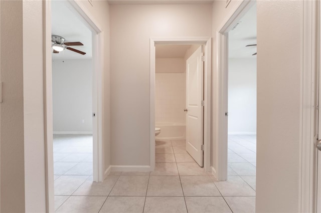 corridor featuring light tile patterned flooring