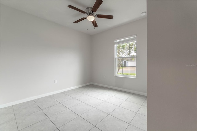 unfurnished room featuring ceiling fan and light tile patterned flooring