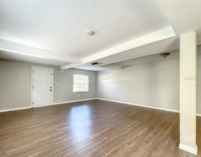 basement featuring dark hardwood / wood-style floors