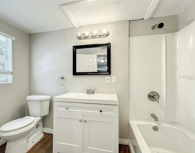 full bathroom featuring toilet, hardwood / wood-style flooring, vanity, and  shower combination