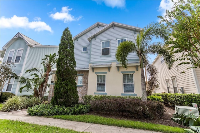 1407 Fairview Cir, Reunion, FL 34747 - view of front of property featuring stone siding