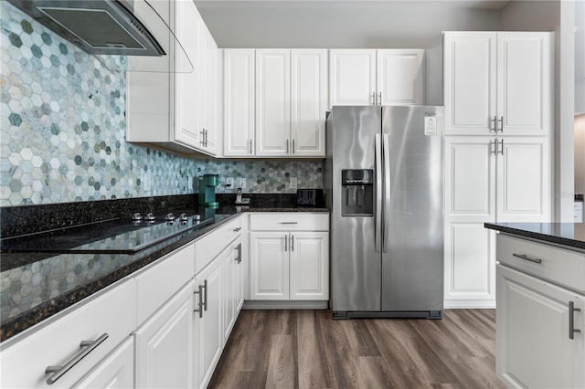 kitchen featuring white cabinets and stainless steel fridge with ice dispenser