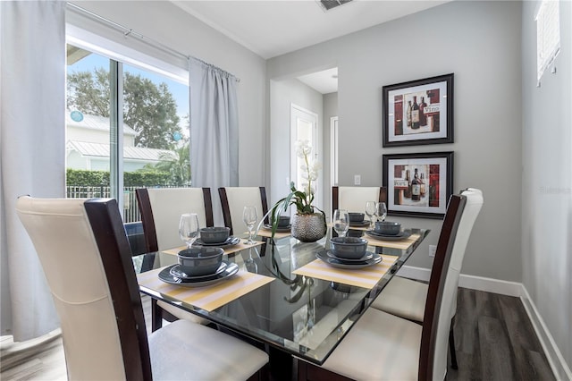 dining space featuring hardwood / wood-style floors