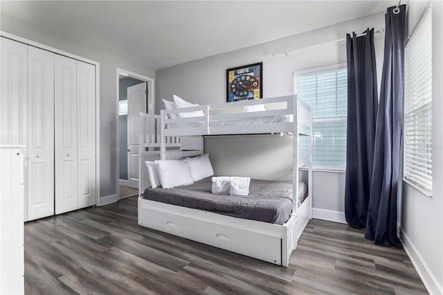 bedroom featuring a closet and dark hardwood / wood-style flooring