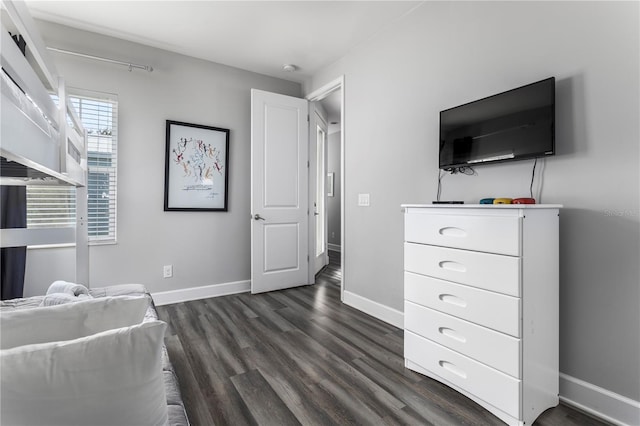 1407 Fairview Cir, Reunion, FL 34747 - living area with dark wood-style flooring and baseboards
