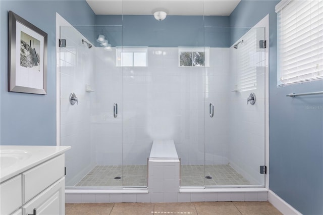 1407 Fairview Cir, Reunion, FL 34747 - bathroom with a shower stall, tile patterned flooring, and vanity