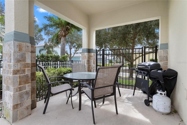 1407 Fairview Cir, Reunion, FL 34747 - balcony with outdoor dining space and a grill