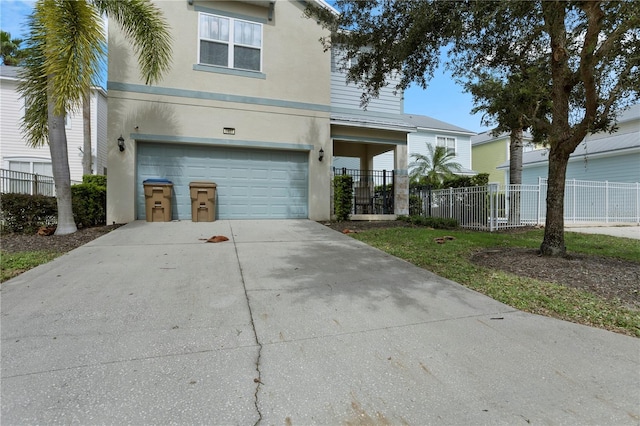1407 Fairview Cir, Reunion, FL 34747 - traditional home with an attached garage, stucco siding, fence, and concrete driveway
