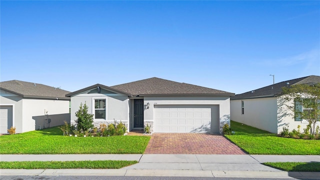 ranch-style home featuring a front yard and a garage