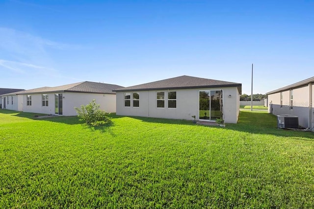 back of house featuring a yard