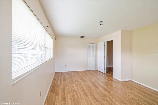 unfurnished room featuring light hardwood / wood-style floors