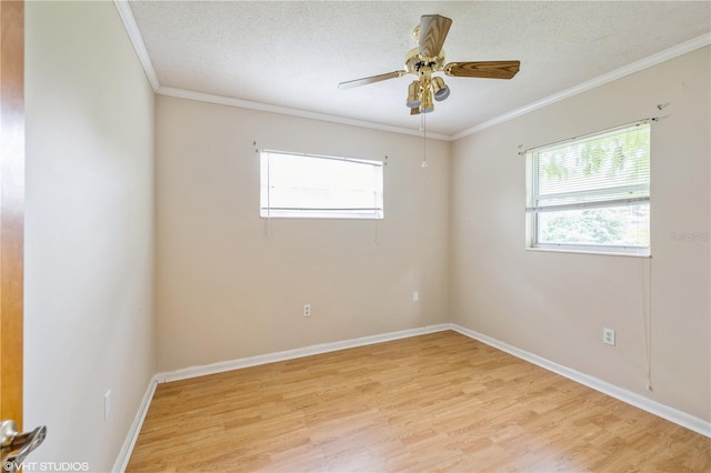 unfurnished room with light wood-type flooring, crown molding, ceiling fan, and a textured ceiling