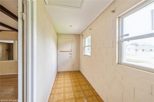 corridor with light parquet flooring