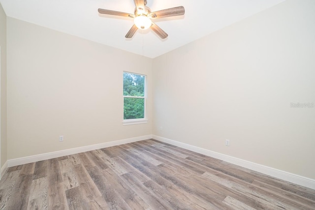 unfurnished room with light hardwood / wood-style flooring and ceiling fan