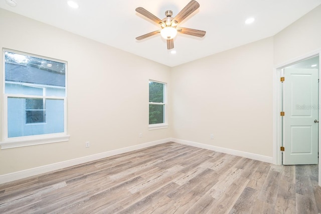 unfurnished room with ceiling fan and light hardwood / wood-style flooring