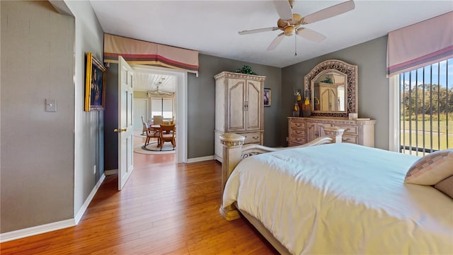 bedroom with light hardwood / wood-style flooring and ceiling fan