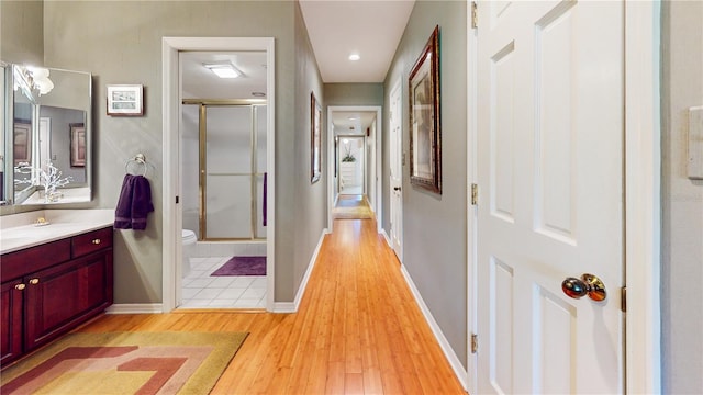 hall with light wood-type flooring