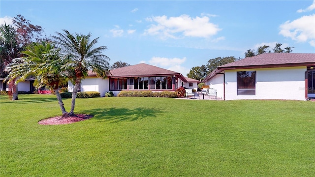 view of yard featuring a sunroom