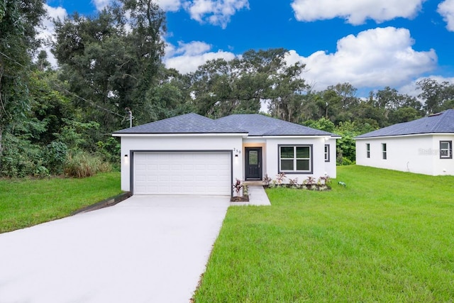 view of front of home featuring a front yard and a garage