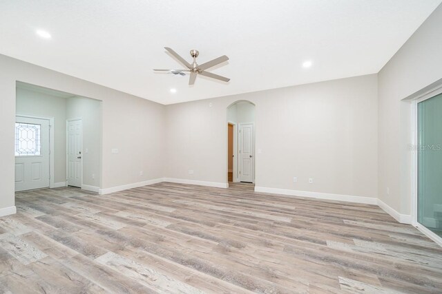 unfurnished room with light hardwood / wood-style flooring and ceiling fan