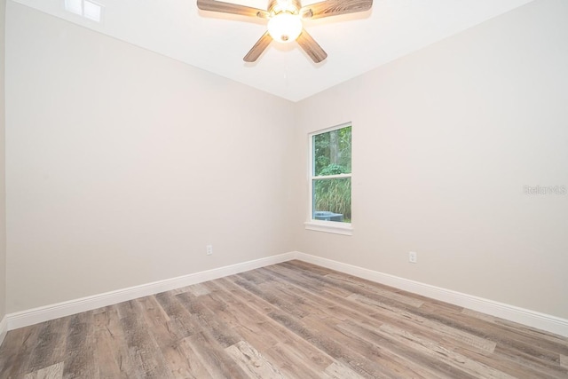 empty room with light hardwood / wood-style floors and ceiling fan