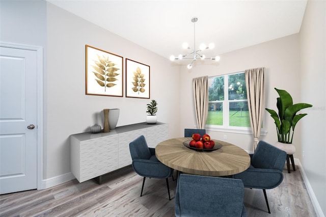 dining space featuring wood-type flooring and a chandelier