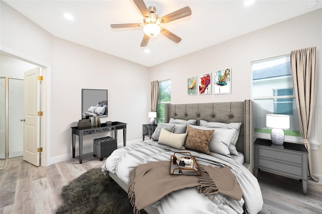 bedroom featuring ceiling fan and light wood-type flooring