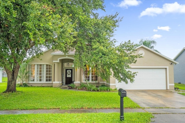 view of front facade with a front lawn and a garage