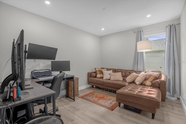 office space with light wood-type flooring