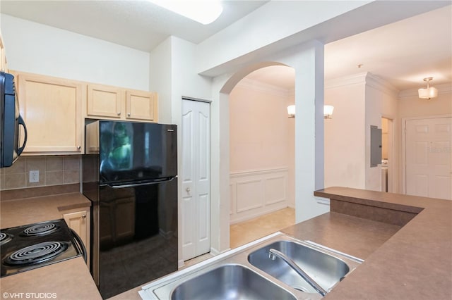 kitchen with light brown cabinets, decorative backsplash, ornamental molding, black appliances, and sink