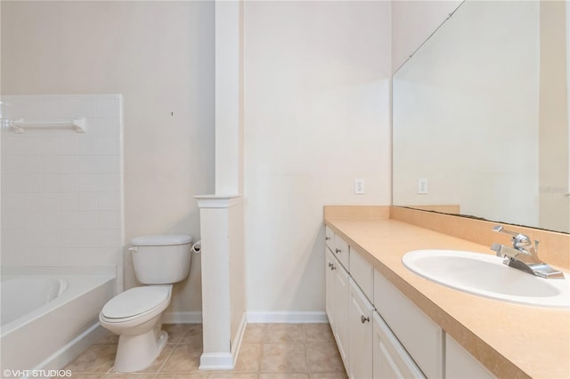 bathroom with vanity, toilet, and tile patterned flooring