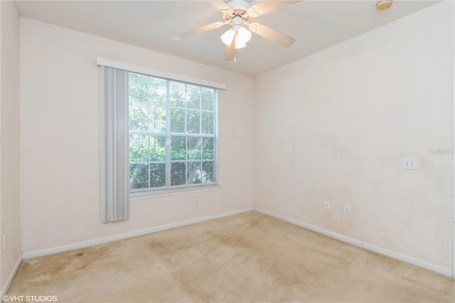 carpeted empty room with ceiling fan