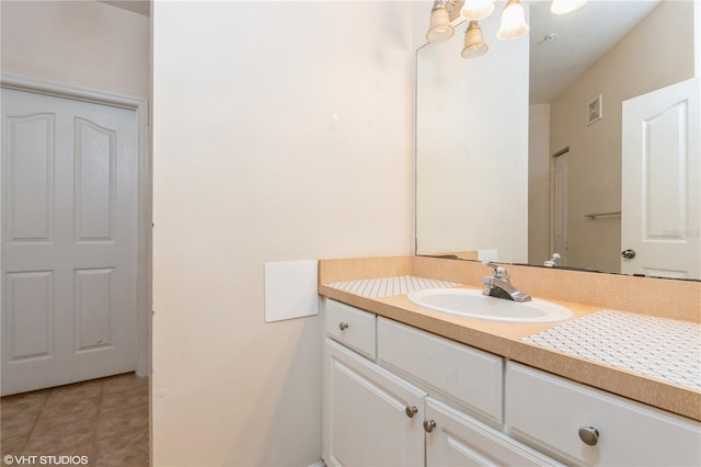 bathroom with vanity and tile patterned flooring