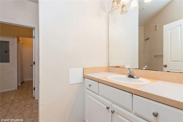 bathroom with vanity, electric panel, and tile patterned flooring