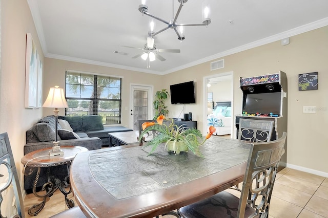 dining area featuring crown molding, light tile patterned flooring, and a notable chandelier