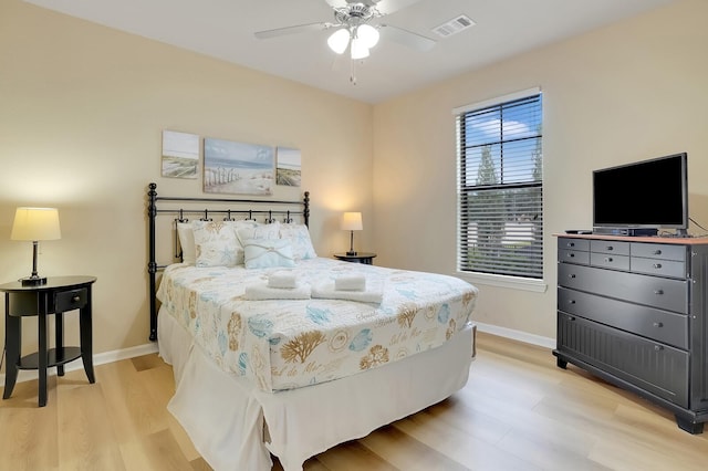 bedroom with light wood-type flooring and ceiling fan