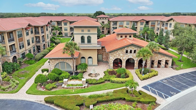 909 Charo Pkwy Unit 1021, Davenport, FL 33897 - view of property with a residential view and uncovered parking