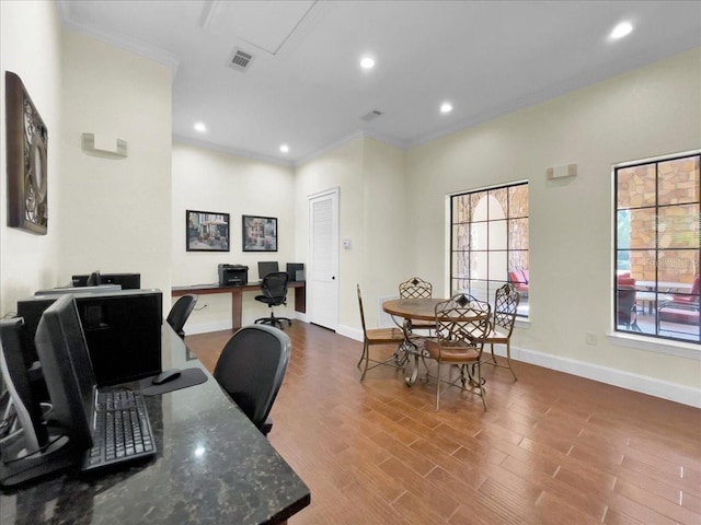 home office with hardwood / wood-style flooring and ornamental molding