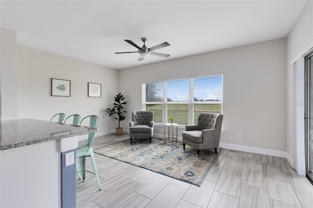 sitting room with ceiling fan