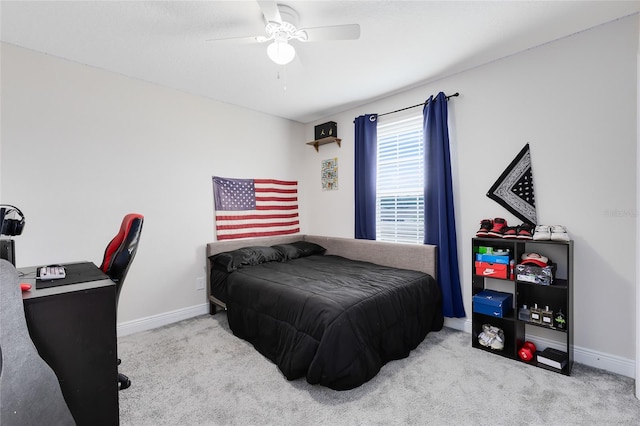 bedroom featuring ceiling fan and light colored carpet