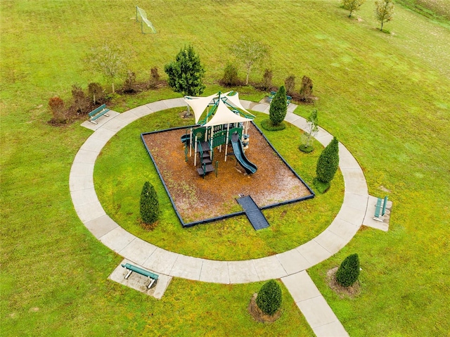 exterior space featuring a lawn and a playground