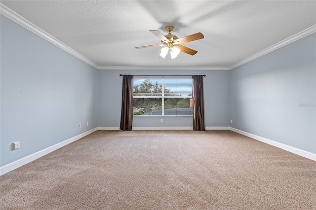 carpeted spare room with ornamental molding, a textured ceiling, and ceiling fan