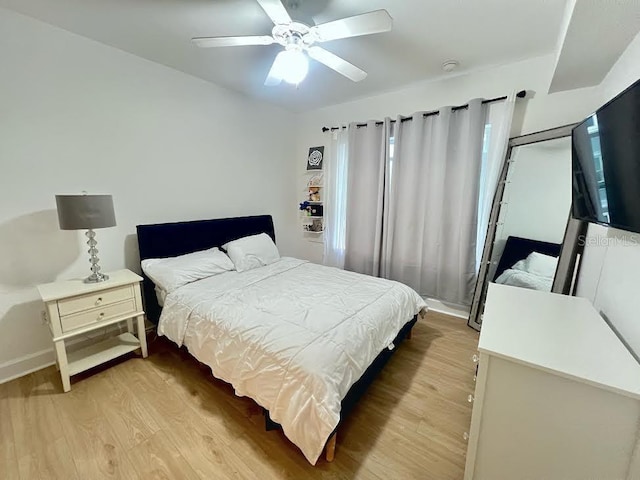 bedroom featuring light hardwood / wood-style floors and ceiling fan