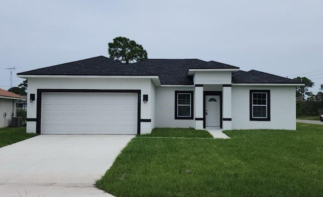 view of front of house featuring a front lawn, central AC unit, and a garage