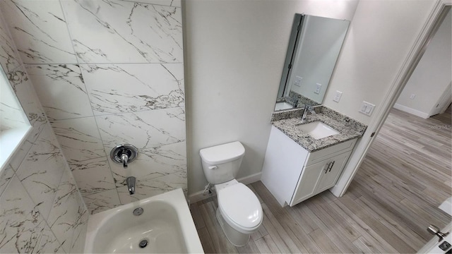 full bathroom with vanity, tiled shower / bath, toilet, and wood-type flooring