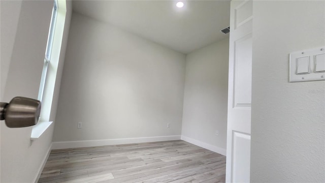 spare room featuring light hardwood / wood-style flooring