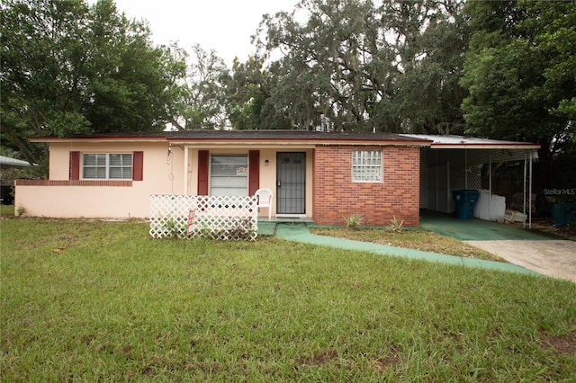 ranch-style house with a carport and a front yard