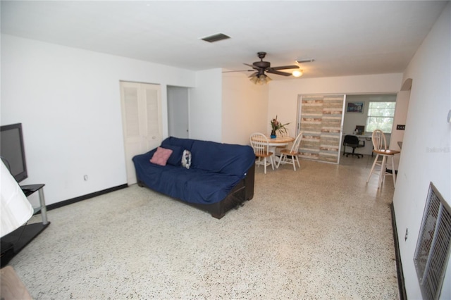 living room with ceiling fan