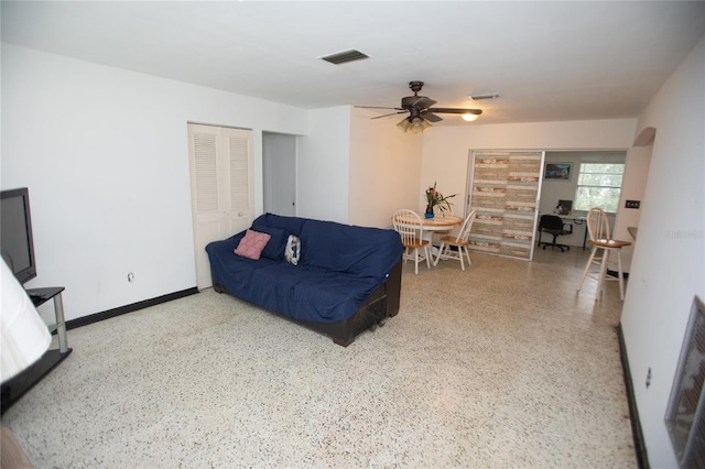 living room featuring ceiling fan