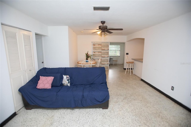 living room featuring ceiling fan